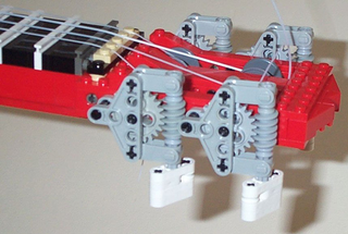Illustration for article titled This Lego Ukulele Sounds Pretty Good